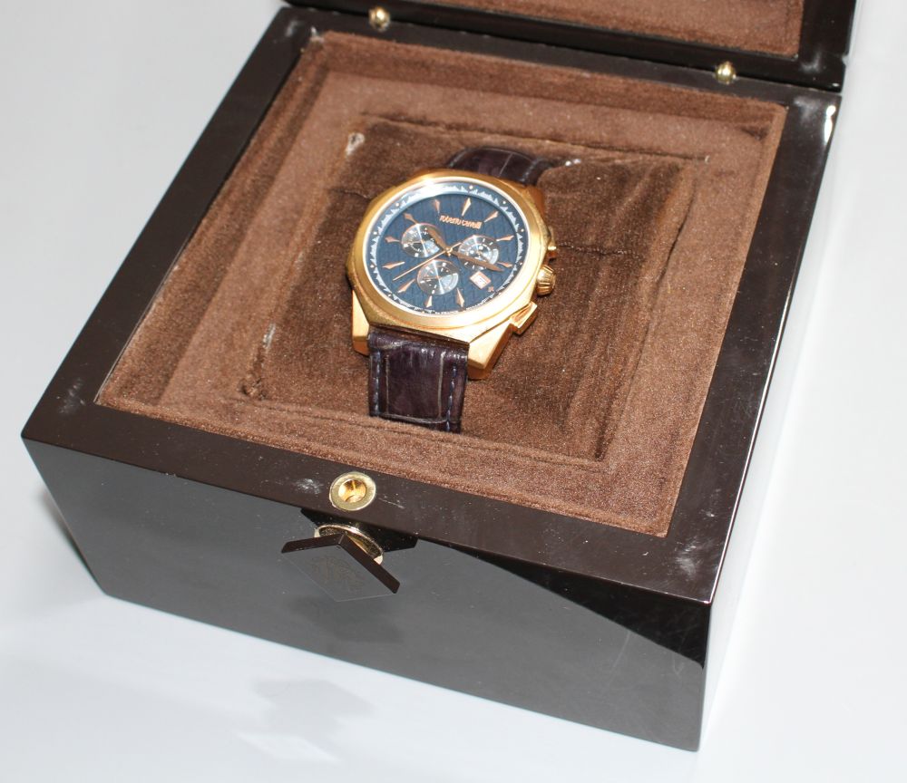 A gentlemans gilt steel Robert Cavalli quartz chronograph wrist watch, with box.